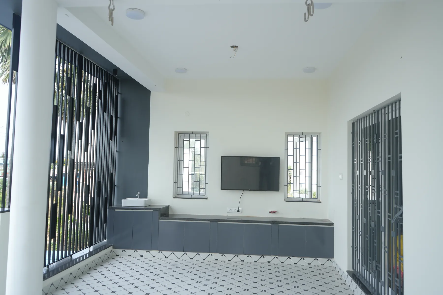 AK Residence — sit-out lounge with jaali screen, Kannivakkam, Chennai