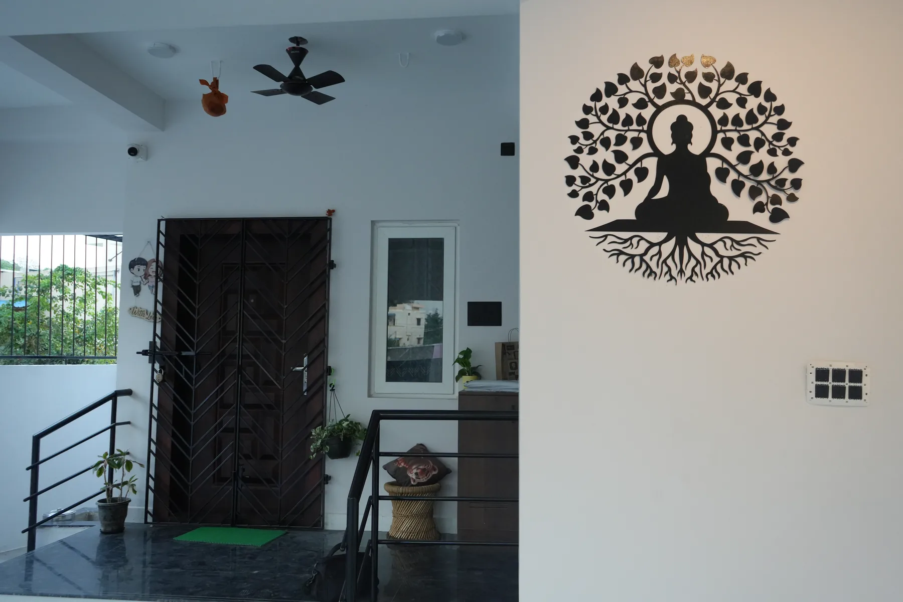 AV Residence — Buddha statue wall art near staircase, Guduvanchery, Chennai