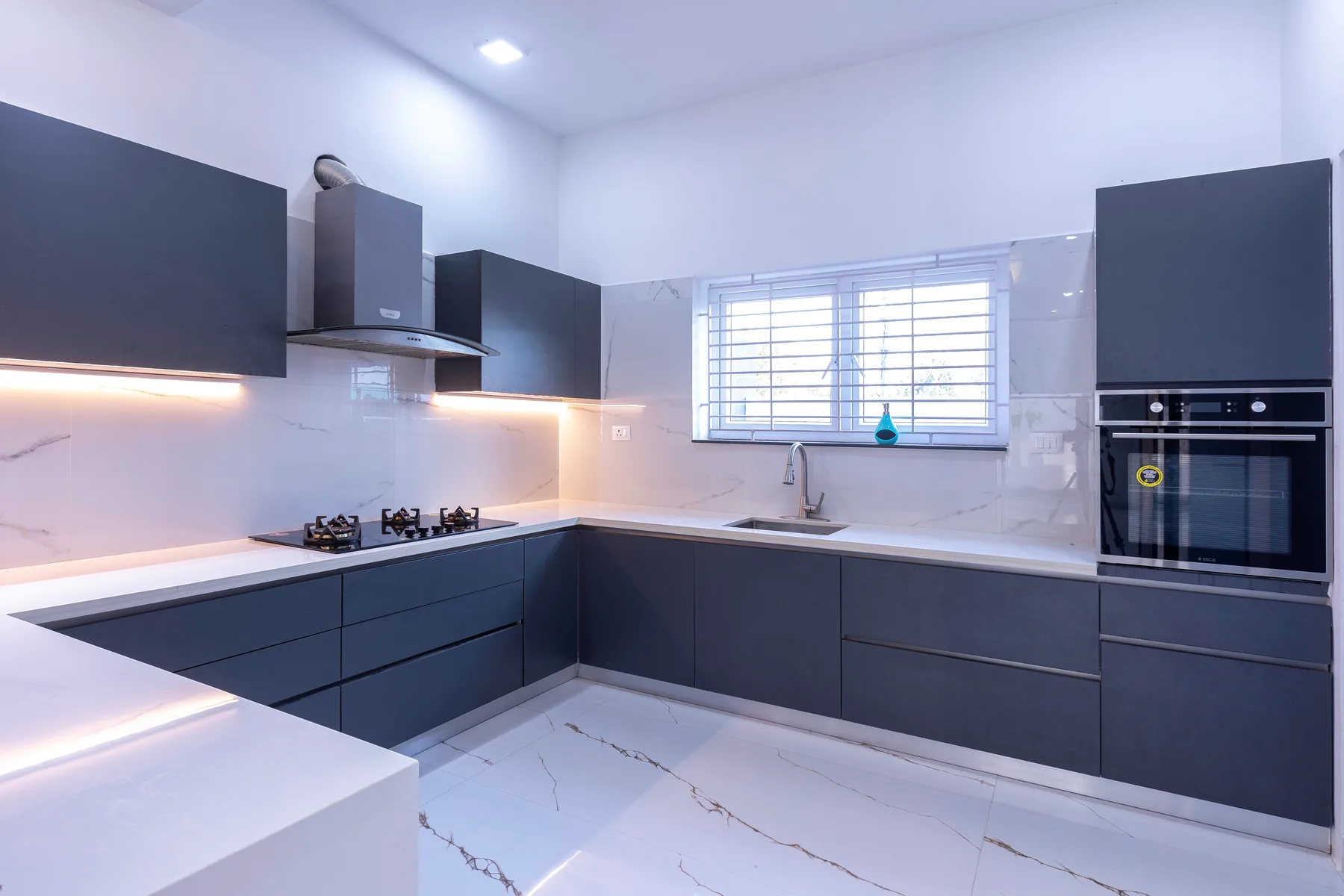 GK Residence — modular kitchen with dark cabinetry, Guduvanchery, Chennai