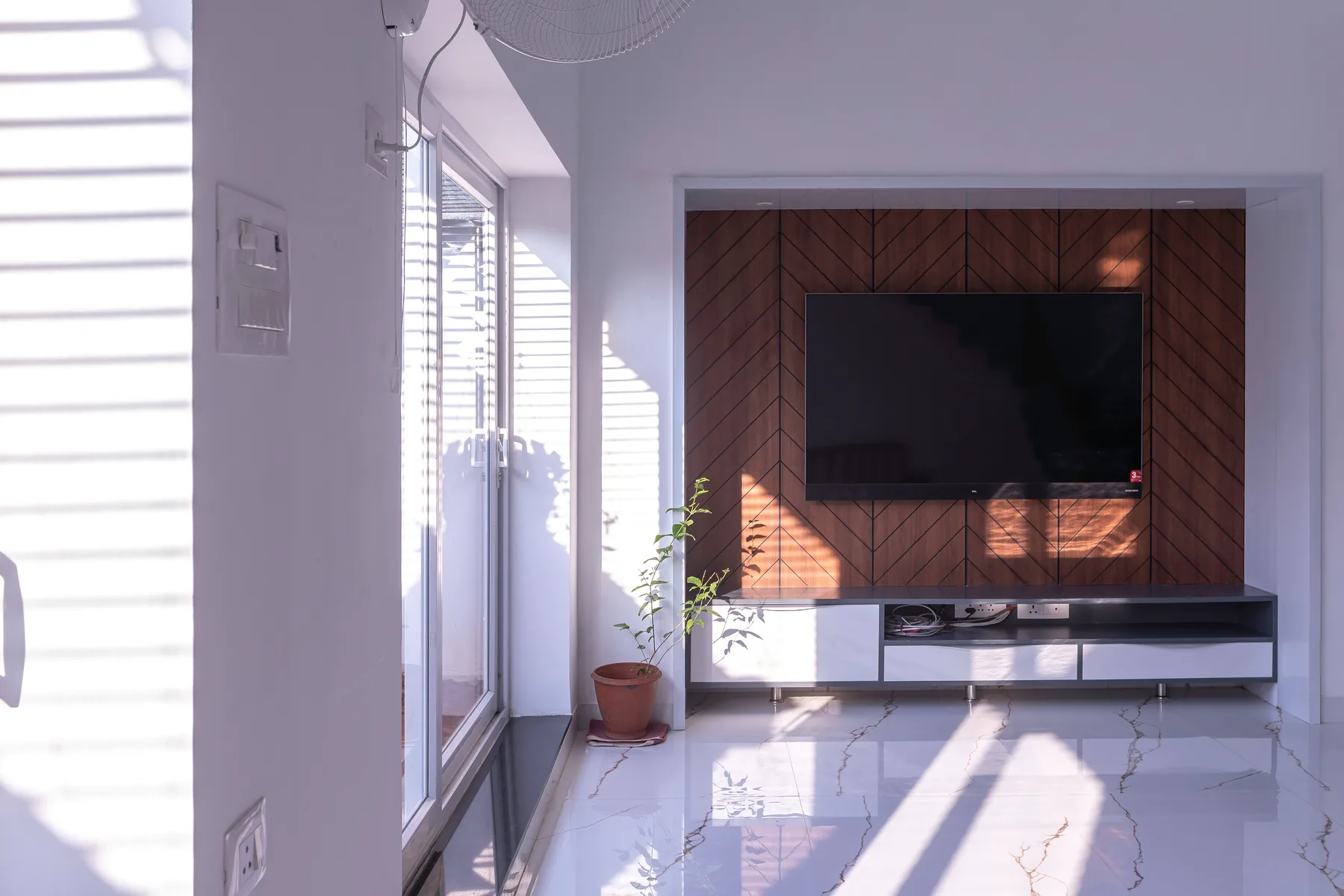GK Residence — wooden herringbone TV feature wall, Guduvanchery, Chennai