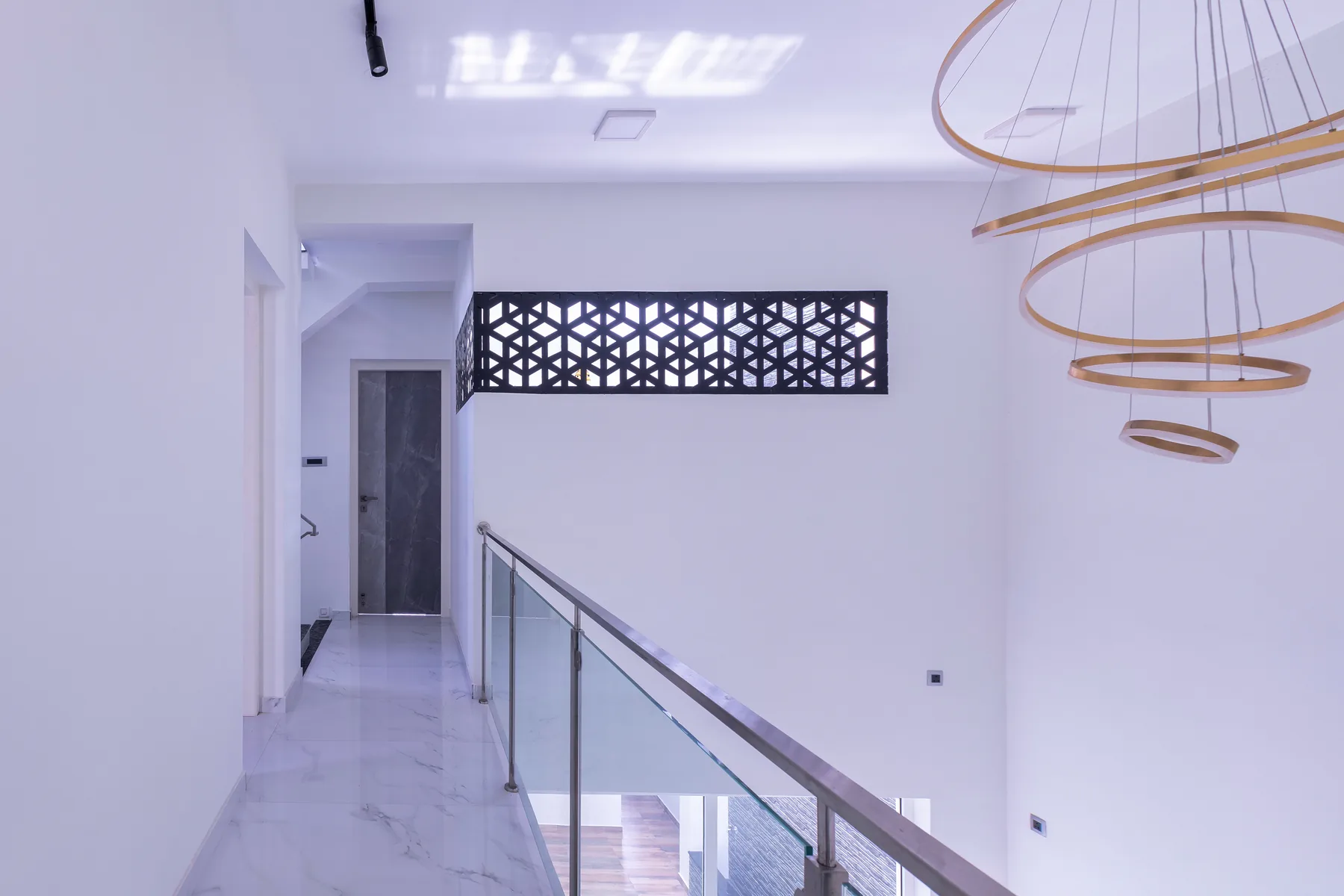 Karthick Residence — upper corridor with geometric jaali panel, Guduvanchery, Chennai