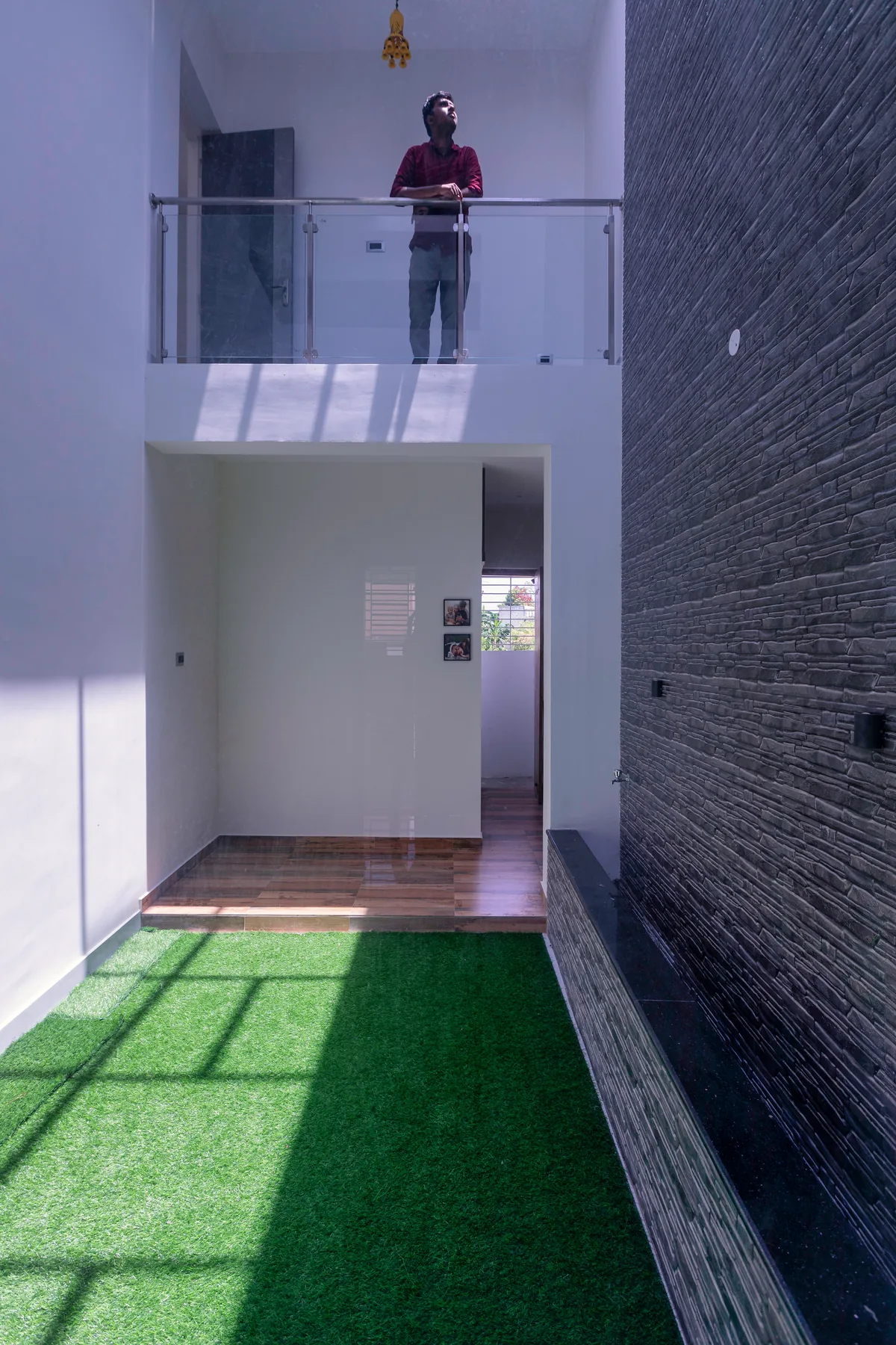 Karthick Residence — internal courtyard with landscaped turf, Guduvanchery, Chennai