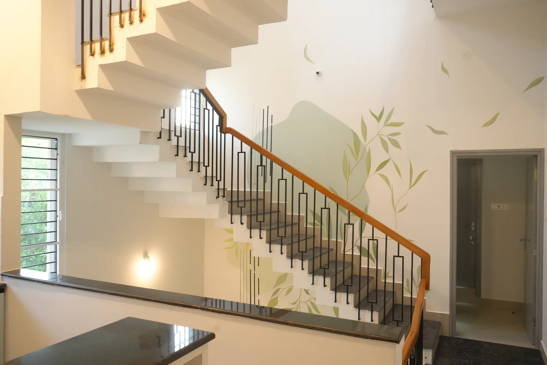 Nila 2.0 — staircase with leaf mural, Thangappapuram, Chennai