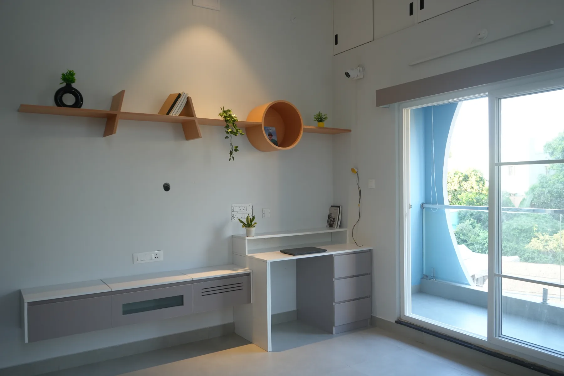 Nila 2.0 — study desk beside circular bedroom window, Thangappapuram, Chennai